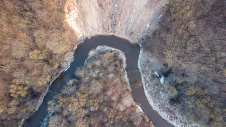 Aerial nature landscape of river and big rocky slopeの写真素材