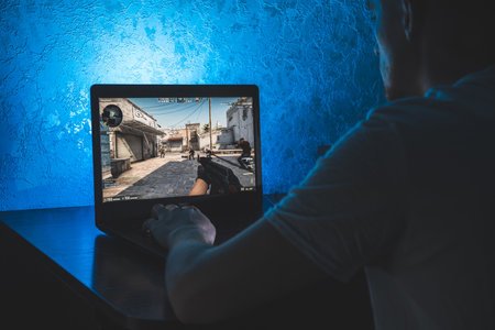 Person playing Counter Strike Global Offensive video game on computerのeditorial素材