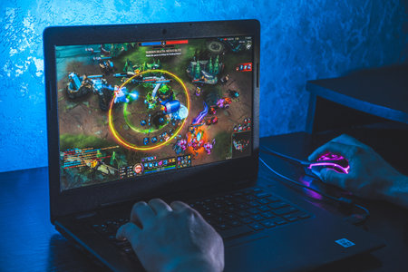 Person playing league of legends video game on computer