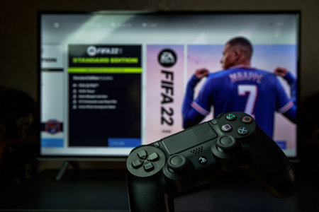 FIFA 2021 video football game on PS4 gaming console.のeditorial素材