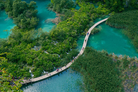 PlitviÄe Lakes National Park is a famous forest reserve in central Croatia. It's known for a chain of 16 terraced lakes, joined by waterfalls, that extend into a limestone canyonのeditorial素材