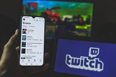 Twitch app on multiple screens. Twitch is an interactive livestreaming service for content spanning gaming, entertainment, sports, music, and moreのeditorial素材
