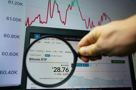 First Bitcoin ETF on market. A bitcoin ETF mimics the price of the digital currency, allowing investors to buy into the ETF without trading bitcoin itself.のeditorial素材