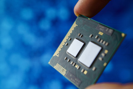 Computer chip in hands. A chipset is a set of electronic component that is integrated and flows data...