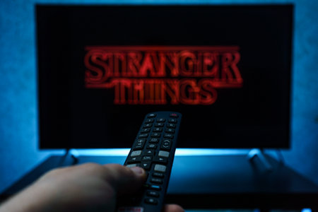 Watching Stranger Things television show on TV. Stranger Things is an American science fiction...