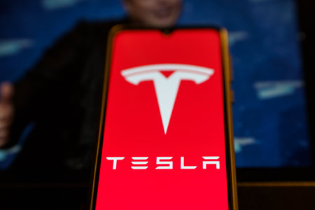 Tesla Model Pi smartphone. Phone made by Elon Musk company Tesla. Tesla on smartphone screenのeditorial素材