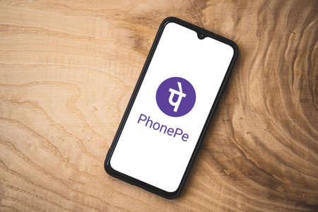 Phonepe application on smartphone. Top angle shot. PhonePe is an Indian digital payments and financial services companyのeditorial素材