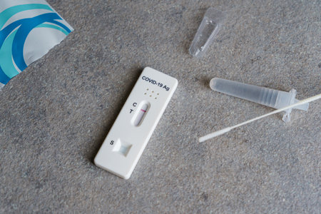 Covid-19 antigen test at home. Negative test result. Self testing rapid coronavirus test.の写真素材