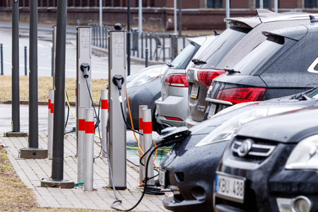 Electric Vehicle Charging Station. Electric cars charge at electric power station. EV charging stationのeditorial素材