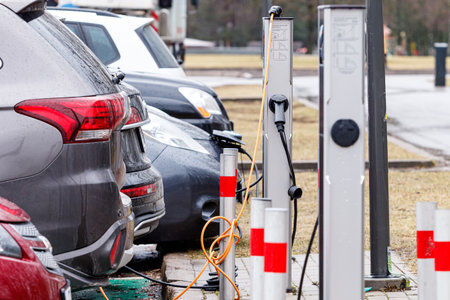 Electric Vehicle Charging Station. Electric cars charge at electric power station. EV charging stationのeditorial素材