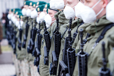 Lithuanian NATO soldier holding gun. The North Atlantic Treaty Organization, also called the North Atlantic Alliance, is an intergovernmental military allianceのeditorial素材