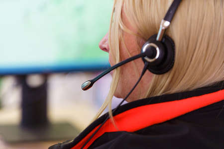 Call center Customer support. Woman talking with clients. Close up shot of headphones