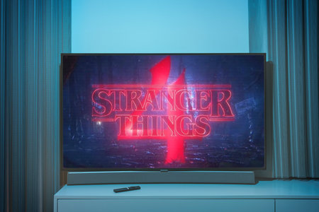 Stranger Thins season 4 TV series on big tv screen. Stranger things television show at homeのeditorial素材