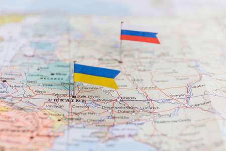 Ukraine and Russia flag on geopolitical map. War in Ukraineの写真素材
