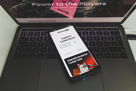 Houston, Texas - 2022, July 12: GameStop NFT marketplace on mobile phone and PC. GameStop launch brand new A non-fungible tokens marketplaceのeditorial素材