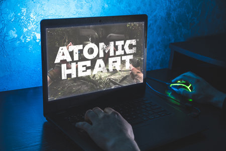 Atomic heart new video game. Close up shoot of playing video game on PCのeditorial素材