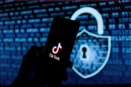 Vilnius, Lithuania - 2023 February 6: TikTok logo on mobile phone screen. TikTok security and data leakのeditorial素材