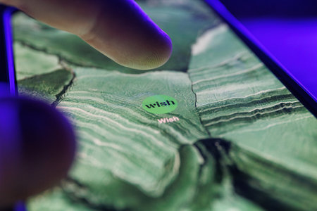 Paris, France - 2023 February 16: Wish shopping app on smartphone screen. Close up shot of wish appのeditorial素材