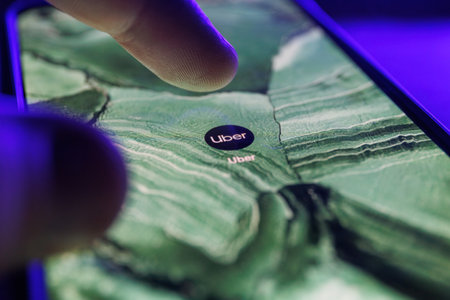 Paris, France - 2023 February 16: Uber app on smartphone screen. Close up shot of Uber app. High quality photoのeditorial素材
