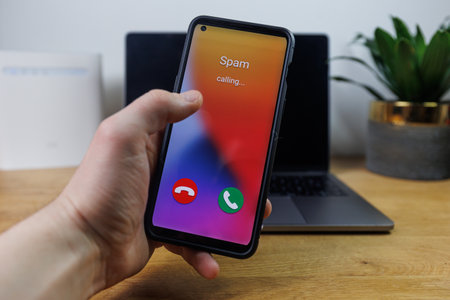 Spam call on phone. Spammer incoming call conceptの写真素材