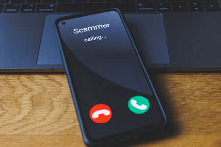 Phone call from scammer. Incoming scam call conceptの写真素材