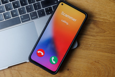 Phone call from scammer. Incoming scam call conceptの写真素材