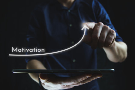 Man points with finger at growing motivation arrow. The concept of motivation. High quality photoの写真素材