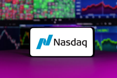 nasdaq stock market index in front of stock market charts backgroundのeditorial素材