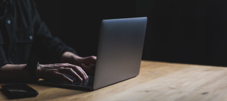Man hands and Laptop on wooden table. Copy space high quality picture. High quality photoの写真素材