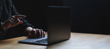 Man hands and Laptop on wooden table. Copy space high quality picture. High quality photoの写真素材