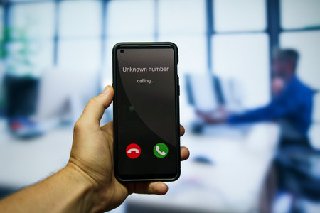 Receiving call from unknown number on mobile phone. High quality photoの写真素材