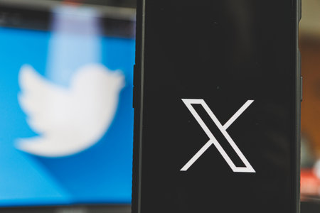 X and the twitter on the screen.