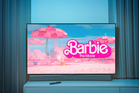 The barbie movie and poster on TV screen
