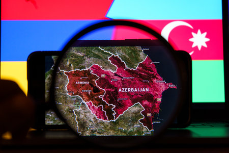 Armenia and Azerbaijan conflict visual view on Google maps in background of national flagsのeditorial素材