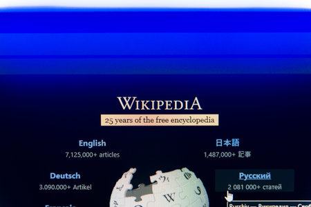 Wikipedia homepage on a computer screen featuring the puzzle globe logo and multiple language options, representing global knowledge sharing, open source education, and digital encyclopedia concept.のeditorial素材