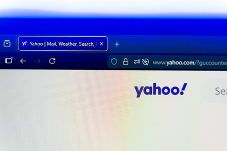 Yahoo homepage displayed on a computer screen with the official logo, search bar, and secure browser address bar, representing global news, web search services, and digital media portal.のeditorial素材