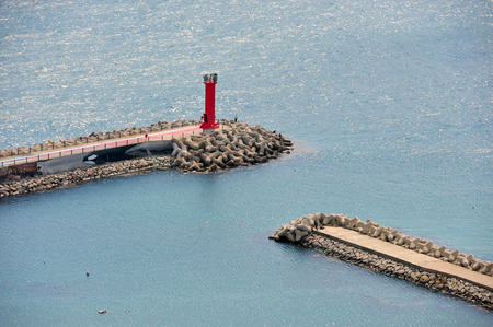 Lighthouse and breakwaterの写真素材