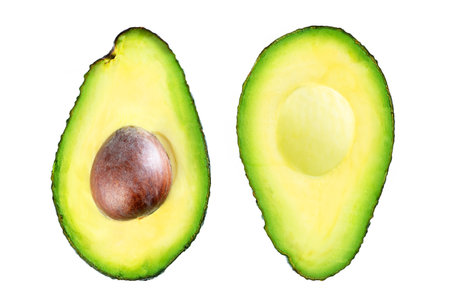 Ripe avocado in halves. Top view on white background.