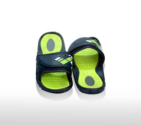 yellow green color Pair of house shoes on a white backgroundの写真素材