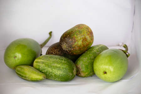 Lots of cucumbers and eggplants together on a white backgroundの写真素材