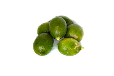 A bunch of lemons and a white background behind itの写真素材