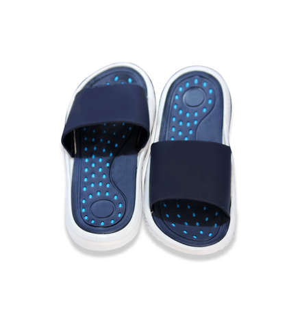 Black color Pair of house shoes on a white backgroundの写真素材