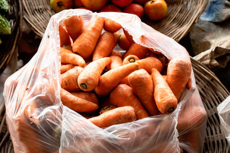 It is a lot of Carrot vegetables in polythene bagsの写真素材