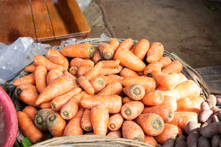 Lots of carrot vegetables in a basketの写真素材