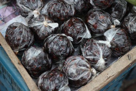 Tamarind ball inside round polythene It's too sourの写真素材