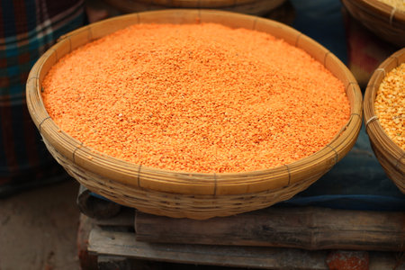 Lentils are orange in color in the traditional bamboo cageの写真素材