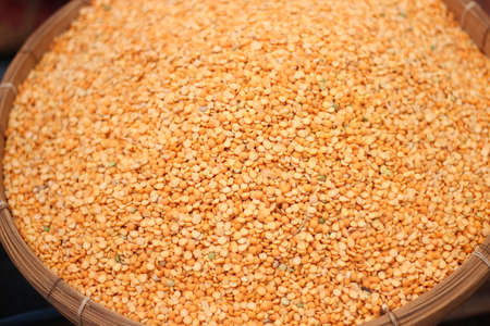 Lentils are yellow colors in the traditional bamboo cageの写真素材