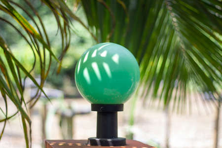 A beautiful round light of green and its background blur.