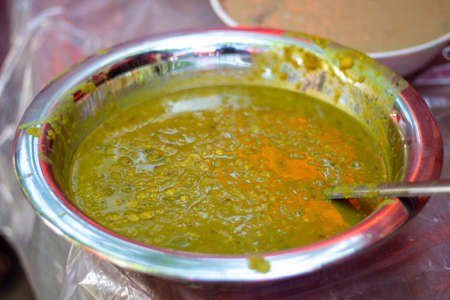 Lentil shoop is cooked with meat fat in a pot