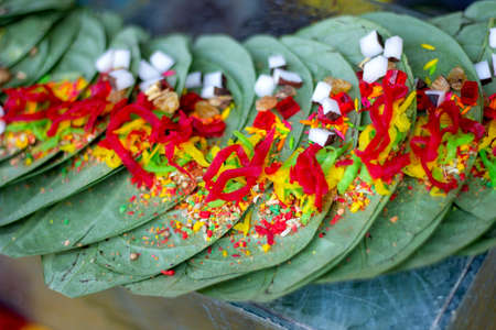 Banarasi betel leaf and various red spices and background blurの写真素材